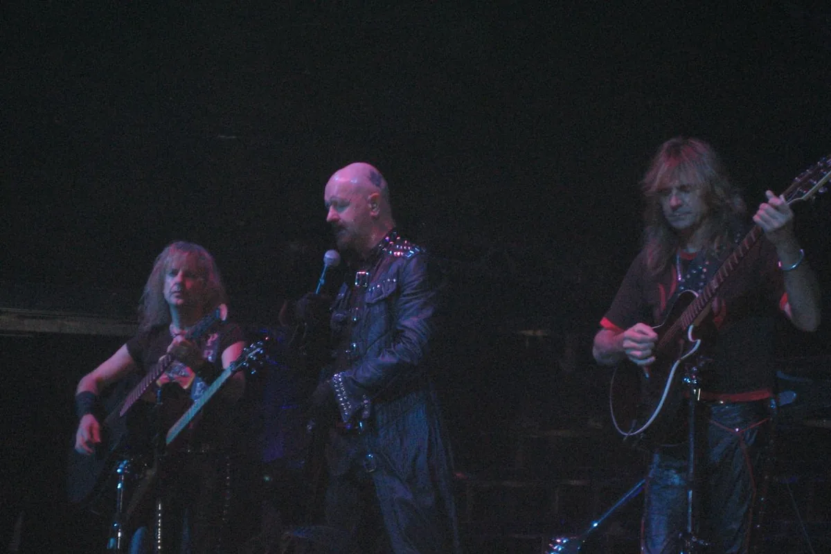 K. K. Downing Rob Halford and Glenn Tipton performing with Judas Priest
